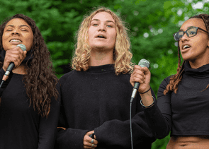 Three people singing